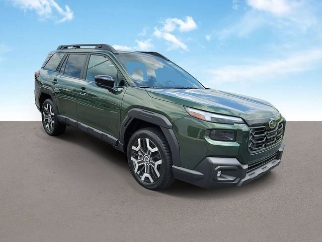 2026 Subaru OUTBACK Touring XT in Deep Emerald Green Pearl — front three-quarter view